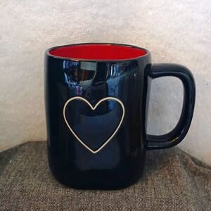 Black mug with heart cut out
